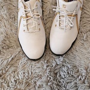 Ladies white with beige detail  footjoy golf shoes, with cleats in size 7.
